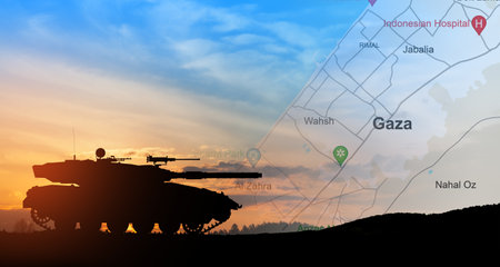 Silhouette of army tank at sunset sky background with map of Gaza. Israeli ground operation in Gaza.の写真素材