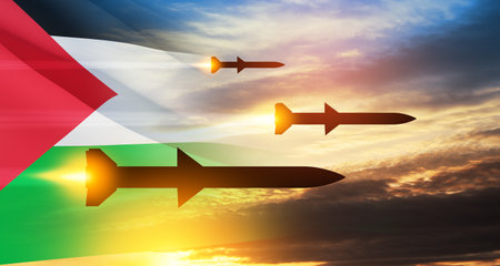 Fired missiles fly to the target. Missiles at the sky at sunset with Palestine flag. Missile defense, a system of salvo fire.の写真素材