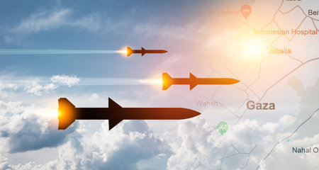Fired missiles fly to the target. Missiles at the sky at sunset with map of Gaza.の写真素材