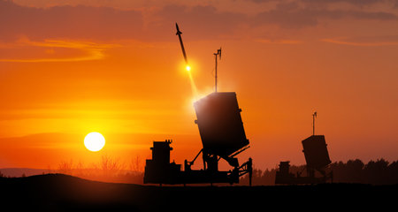 Israel's Iron Dome air defense missile launches. The missiles are aimed at the sky at sunset. Missile defense, a system of salvo fire.の写真素材
