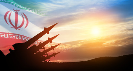 The missiles are aimed at the sky at sunset with Iran flag. Bomb, chemical weapons, missile defense, a system of salvo fire.の写真素材