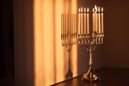 Hanukkah menorah, or hanukkiah in the light of the sun at sunset for Jewish holiday Hanukkah.の写真素材