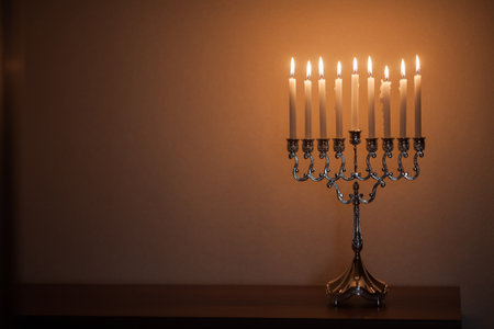 Hanukkah menorah, or hanukkiah in the light of the sun at sunset for Jewish holiday Hanukkah.の写真素材