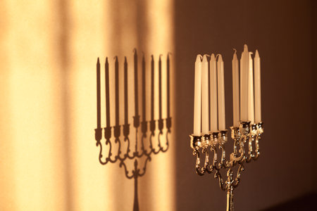 Closeup of Hanukkah menorah, or hanukkiah in the light of the sun at sunset for Jewish holiday Hanukkah.の写真素材