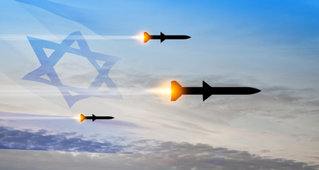 Fired missiles fly to the target. Missiles at the sky at sunset with Israel flag. Missile defense, a system of salvo fire.の写真素材