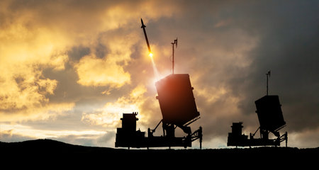 Israel's Iron Dome air defense missile launches. The missiles are aimed at the sky at sunset. Missile defense, a system of salvo fire.の写真素材