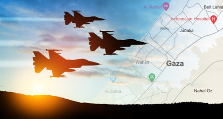 Silhouettes of fight planes on background of sunset with map of Gaza. Israeli ground operation in Gaza.の写真素材