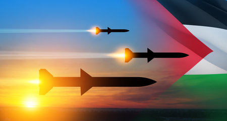 Fired missiles fly to the target. Missiles at the sky at sunset with Palestine flag. Missile defense, a system of salvo fire.の写真素材