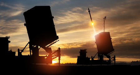 Israel's Iron Dome air defense missile launches. The missiles are aimed at the sky at sunset. Missile defense, a system of salvo fire.の写真素材
