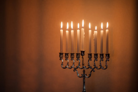 Closeup of Hanukkah menorah, or hanukkiah in the light of the sun at sunset for Jewish holiday...