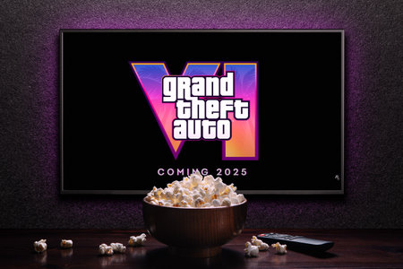 Grand Theft Auto 6 trailer game on TV screen. TV with remote control and popcorn bowl. Astana,...