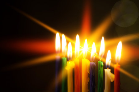 Closeup of Hanukkah menorah, or hanukkiah for Jewish holiday Hanukkah. Nine colored candles. Hanukkah lamp, nine-branched candelabrum. Selective focus.の写真素材