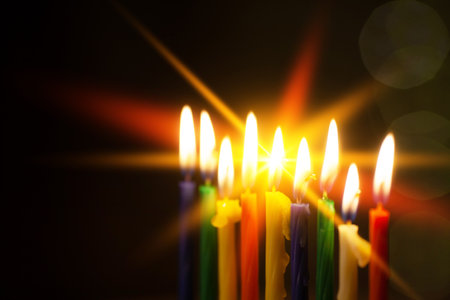 Closeup of Hanukkah menorah, or hanukkiah for Jewish holiday Hanukkah. Nine colored candles. Hanukkah lamp, nine-branched candelabrum. Selective focus.の写真素材