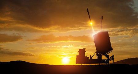 Israel's Iron Dome air defense missile launches. The missiles are aimed at the sky at sunset. Missile defense, a system of salvo fire.の写真素材