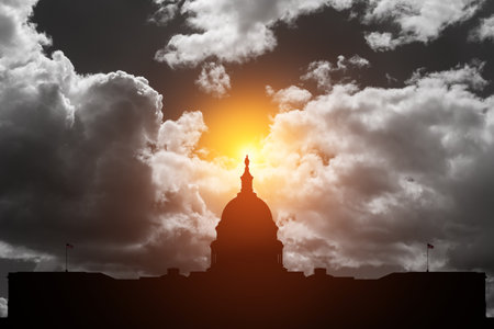 The United States Capitol building silhouette on background of black and white sky at sunset in Washington DC, USAの写真素材