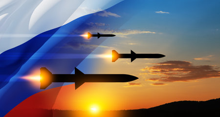 Fired missiles fly to the target. Missiles at the sky at sunset. Missile defense, a system of salvo fire.の写真素材