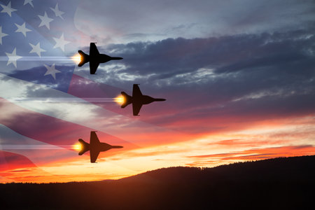 Air Force Day. Aircraft silhouettes on background of sunset with a transparent American flag.の写真素材