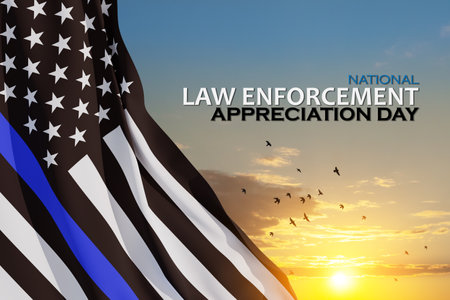 Law enforcement appreciation day is observed every year on January 9. USA flag and inscription on background of sunset sky with flying birds.の写真素材
