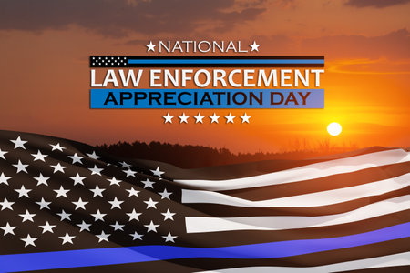 Law enforcement appreciation day is observed every year on January 9. USA flag and inscription on background of sunset sky.の写真素材