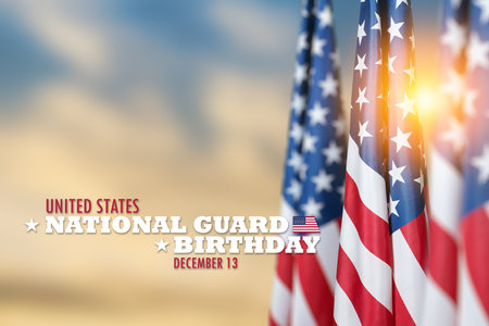 United States National Guard birthday inscription with USA flags on background of sunset sky. American holiday poster. Banner, flyer, sticker, greeting card, postcard.の写真素材