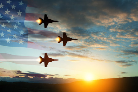 Aircraft silhouettes on background of sunset.の写真素材