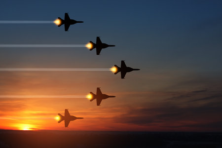 Air Force Day. Aircraft silhouettes on background of sunset.の写真素材