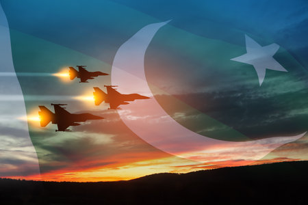 Air Force Day. Aircraft silhouettes on background of sunset with a transparent Pakistan flag.