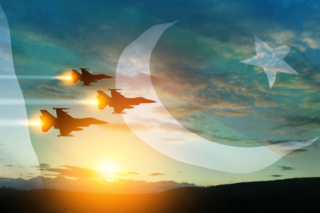 Air Force Day. Aircraft silhouettes on background of sunset with a transparent Pakistan flag.の写真素材