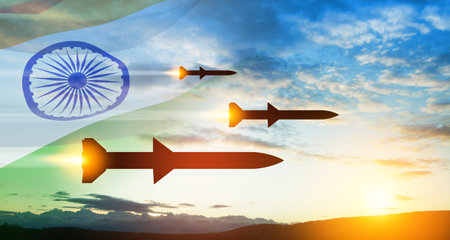 Fired missiles fly to the target. Missiles at the sky at sunset with Indian flag.の写真素材