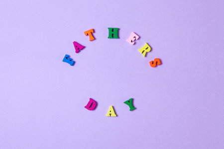 Childs toy letters spelling Fathers Day on purple backgroundの写真素材