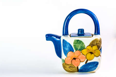 colorful tea pot isolating on white blackgroundの写真素材