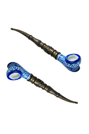 two antique precious pipes isolated on white backgroundの写真素材