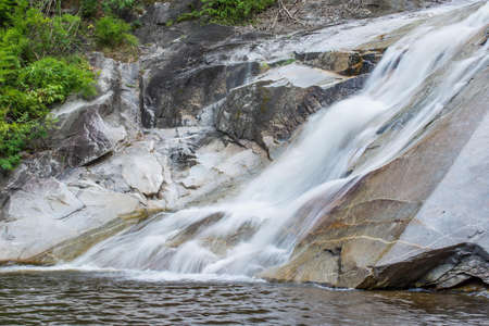 flowing waterfall on mountain in Suan Phueng, Ratchaburi province, Thailandの写真素材