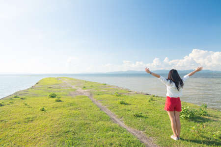 young woman feel fresh on sunshine dayの写真素材