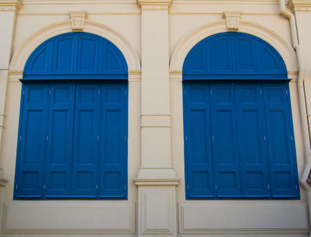 beautiful blue windows of antique buildingの写真素材