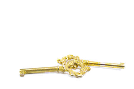 precious golden ancient keys isolated on white background : the concept of soul mateの写真素材