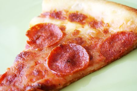 slice of pepperoni pizzaの写真素材