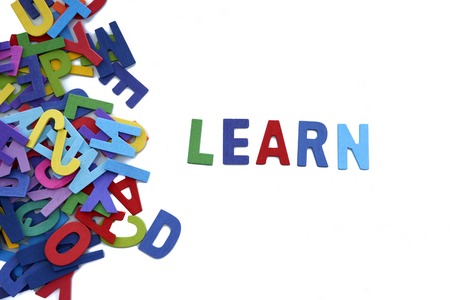 colorful wooden word Learn  letters isolated over the white backgroundの写真素材