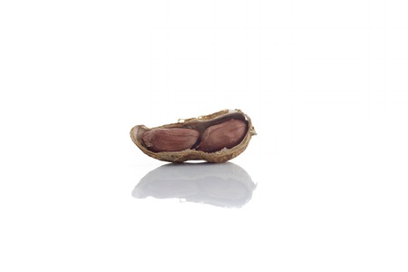 Peanuts.peeled nuts isolated on white background. Peanut macro. Selective Focus