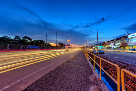 1 Dec 2017 Taman Perlin, Johor Bahru, Malaysia :Light trails at blue hour on road of traffic lights with long exposure photographyのeditorial素材