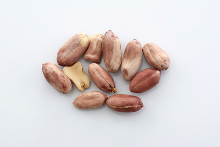 Peanuts.peeled nuts isolated on white background. Peanut macro. Selective Focus