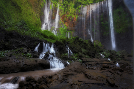Beautiful Tumpak Sewu waterfall, Tumpak Sewu Waterfall or also called Coban Sewu is a 120 meter high waterfall located in Lumajang Regency, East Java. Tumpak Sewu Waterfall is the most beautiful waterfall on Java and Indonesia. Long Exposure.の写真素材