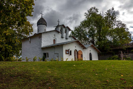 An ancient white Orthodox Christian church in the center of the old city of Pskov. Landmark of Russia and the Pskov region, tourist destinationの写真素材