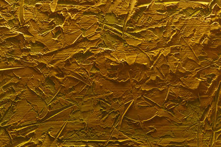 Part of a beautiful abstract loft decorative yellow wall with golden stucco. Art cover stylized textural banner with space for text decoration.の写真素材