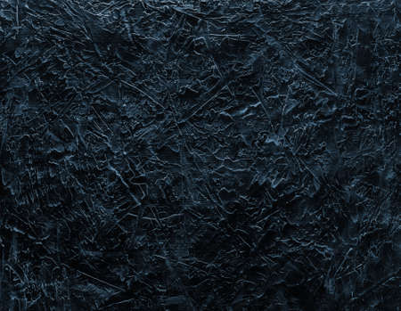 Part of a beautiful abstract loft decorative black wall with ultramarine stucco scratches. Art cover...