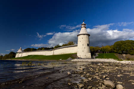 View of the Pskov Kremlin near the city river on a summer clear day. Trails for walking tourists.のeditorial素材