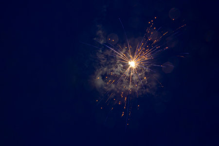 Abstract brightly colorful colored fireworks background on a twilight background with free space for text. Celebration and holiday conceptの写真素材