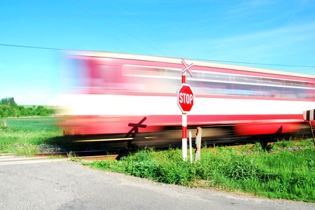 Commuter train passed the grade crossing.の写真素材