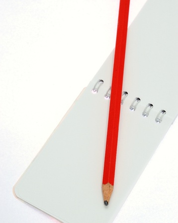 Detail image of white paper notes and red pen.の写真素材