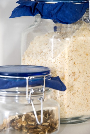 Image of two kitchen jars with mushroom and breadcrumb.の写真素材